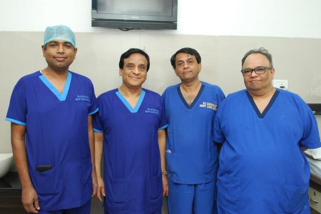 Four doctors in scrubs at Dr Godbole's Heart Care Hospital